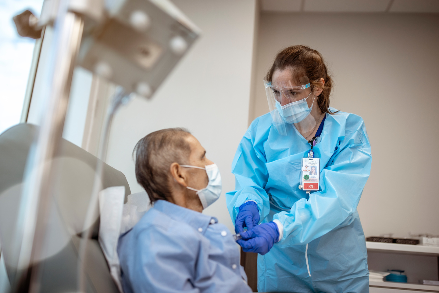 Dentist helping an older patient.
